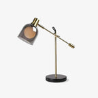 Clérachic brass table lamp with a smoke-glass dome shade over an opal globe, shown alone on a plain white background.