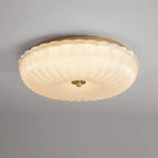 Round frosted glass ceiling light mounted flush to the ceiling