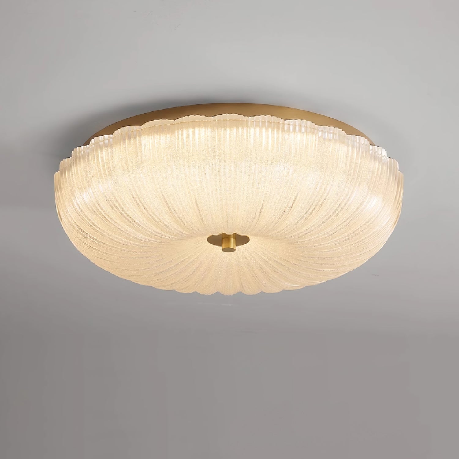 Round frosted glass ceiling light mounted flush to the ceiling