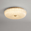 Frosted glass ceiling light glowing softly in a styled room