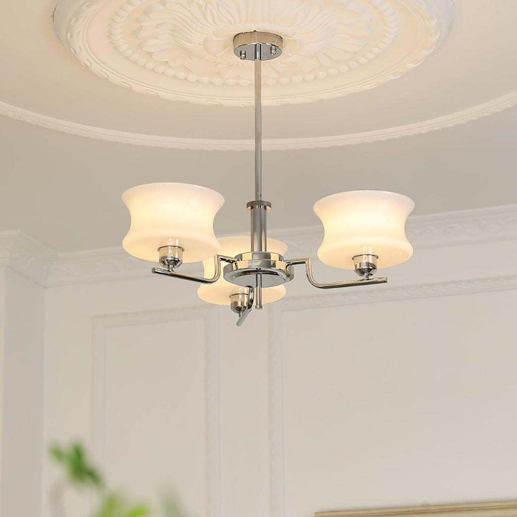 Globe chandelier with warm glow illuminating a styled interior