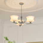 Globe chandelier with warm glow illuminating a styled interior