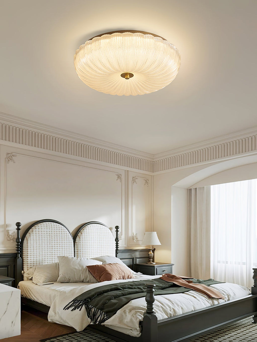 Gold and frosted glass ceiling light in a modern interior