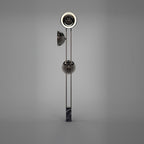 Full-length studio shot of the Clérachic floor lamp on a plain grey backdrop, showing its slim black marble base.