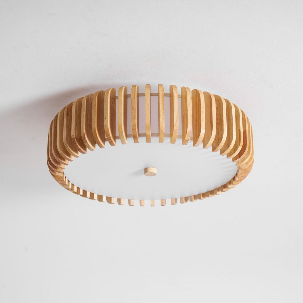 A side-angled studio shot shows this Clérachic ceiling light lit, slats catching the light unevenly.