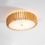 Close view of this Clérachic ceiling light mounted near a wall, wood slats glowing warm.