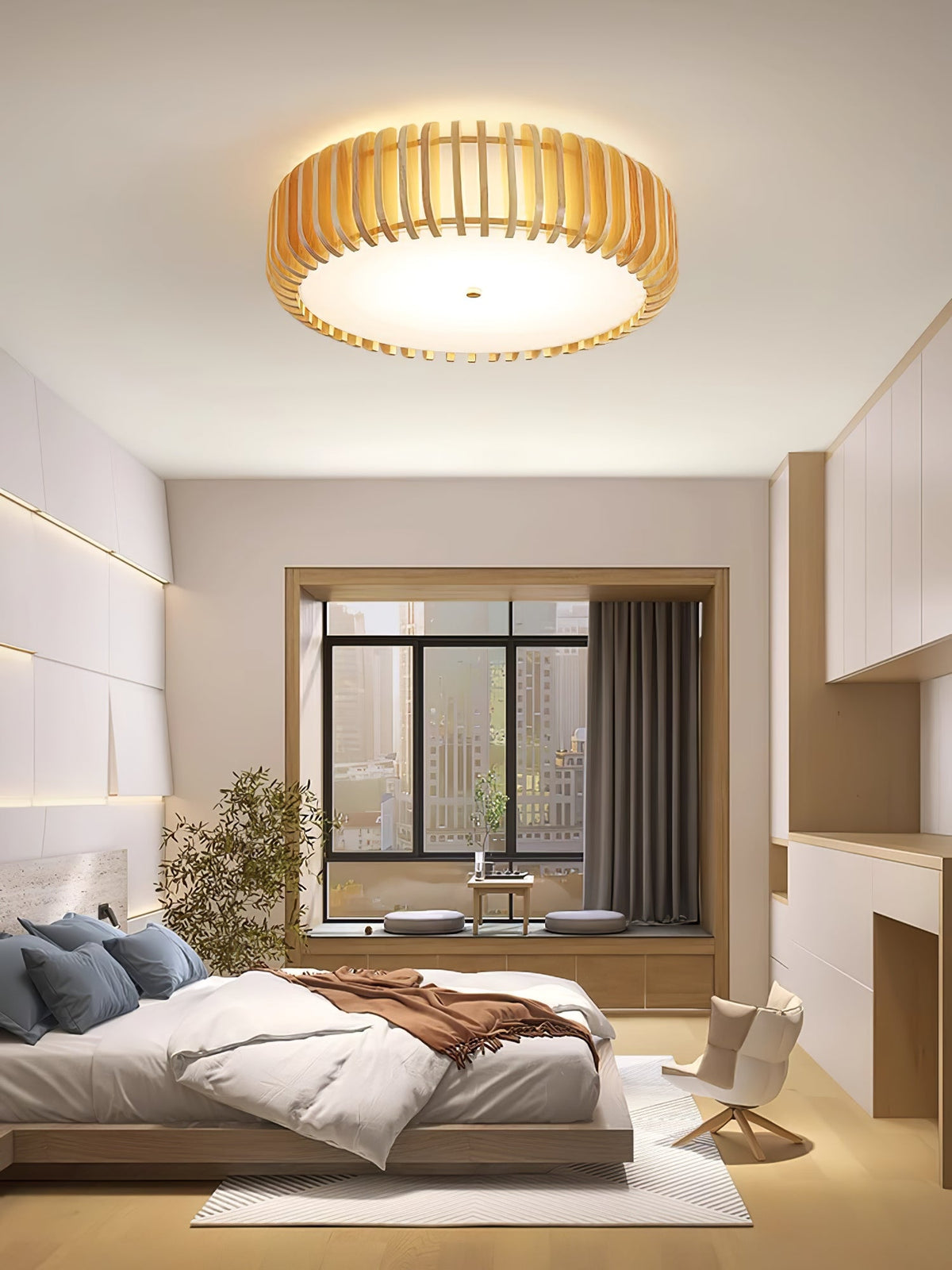 A window seat and city skyline sit below this Clérachic ceiling light, lit, in the evening.