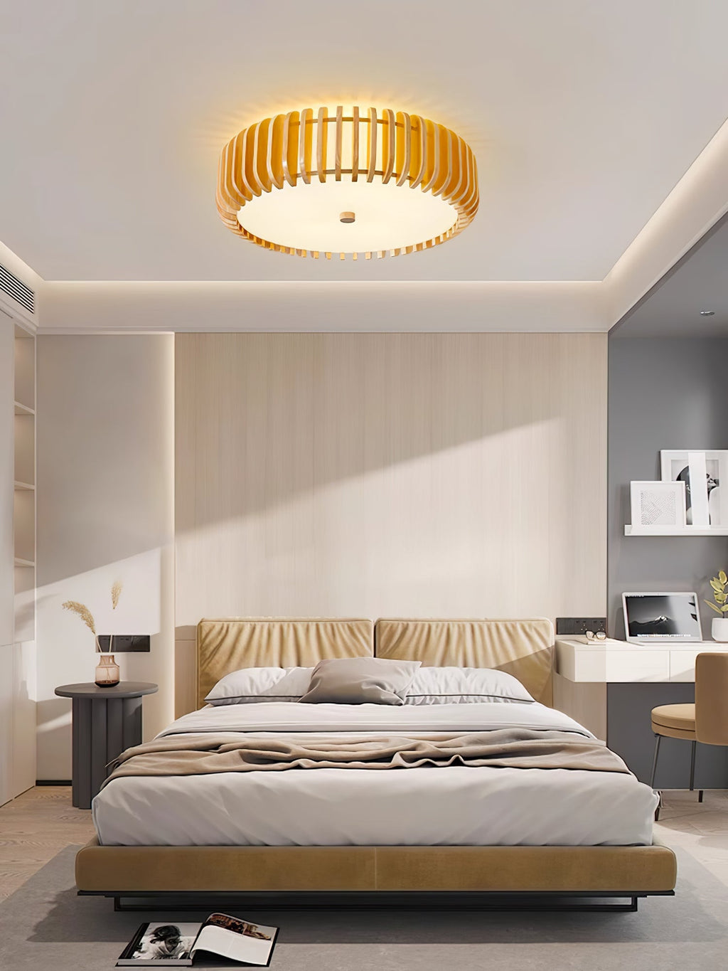 A padded headboard and open shelving sit below this Clérachic ceiling light, lit, in a bedroom.