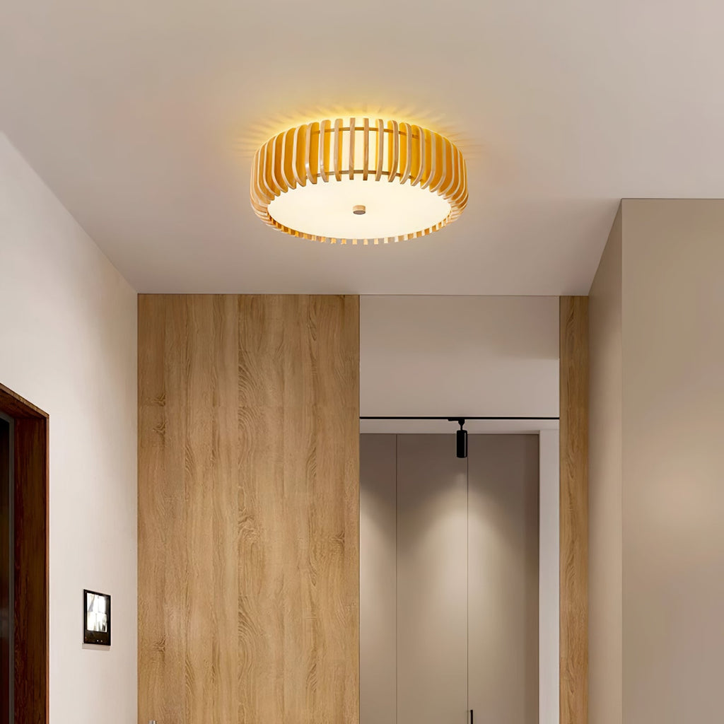 Wood-panelled wardrobe doors line the hallway lit by this Clérachic ceiling light overhead.