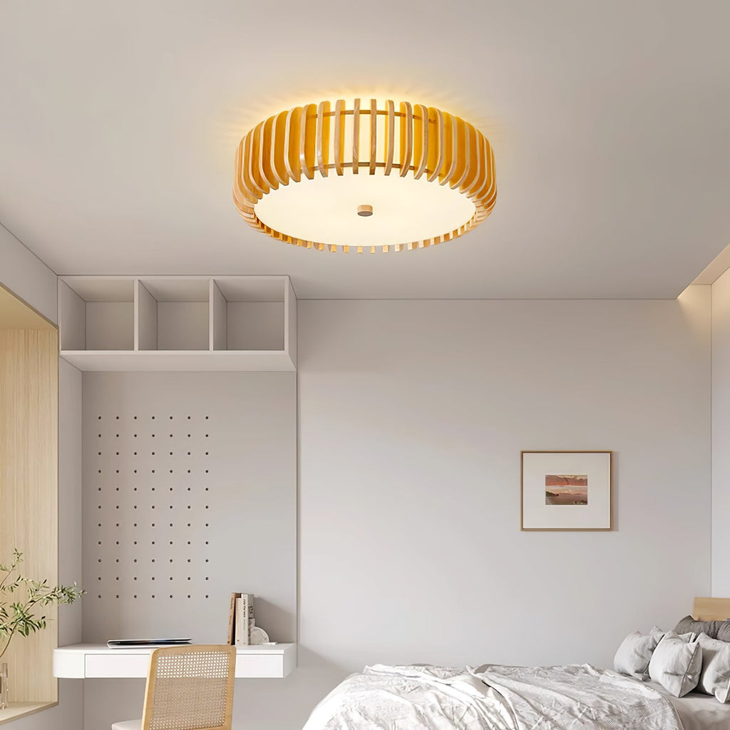 Warm glow from this Clérachic ceiling light over a bed beside open cubby shelving.
