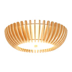 Straight-on underside view of this Clérachic ceiling light lit, glow spreading evenly through the slats.