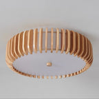 Underside studio view of this Clérachic ceiling light, unlit, wood slats framing a plain white diffuser.