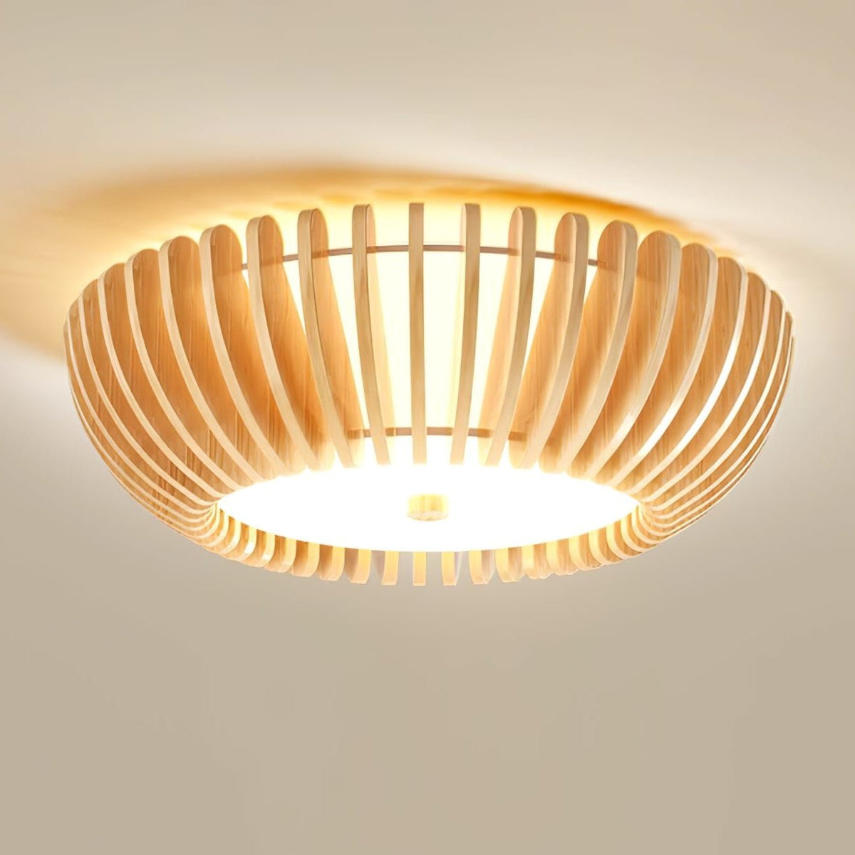 Close angled view of this Clérachic ceiling light lit, wood slats catching the warm light.