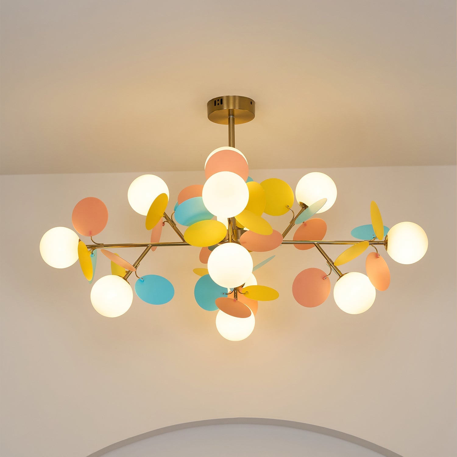 Tree chandelier installation reference in a styled room