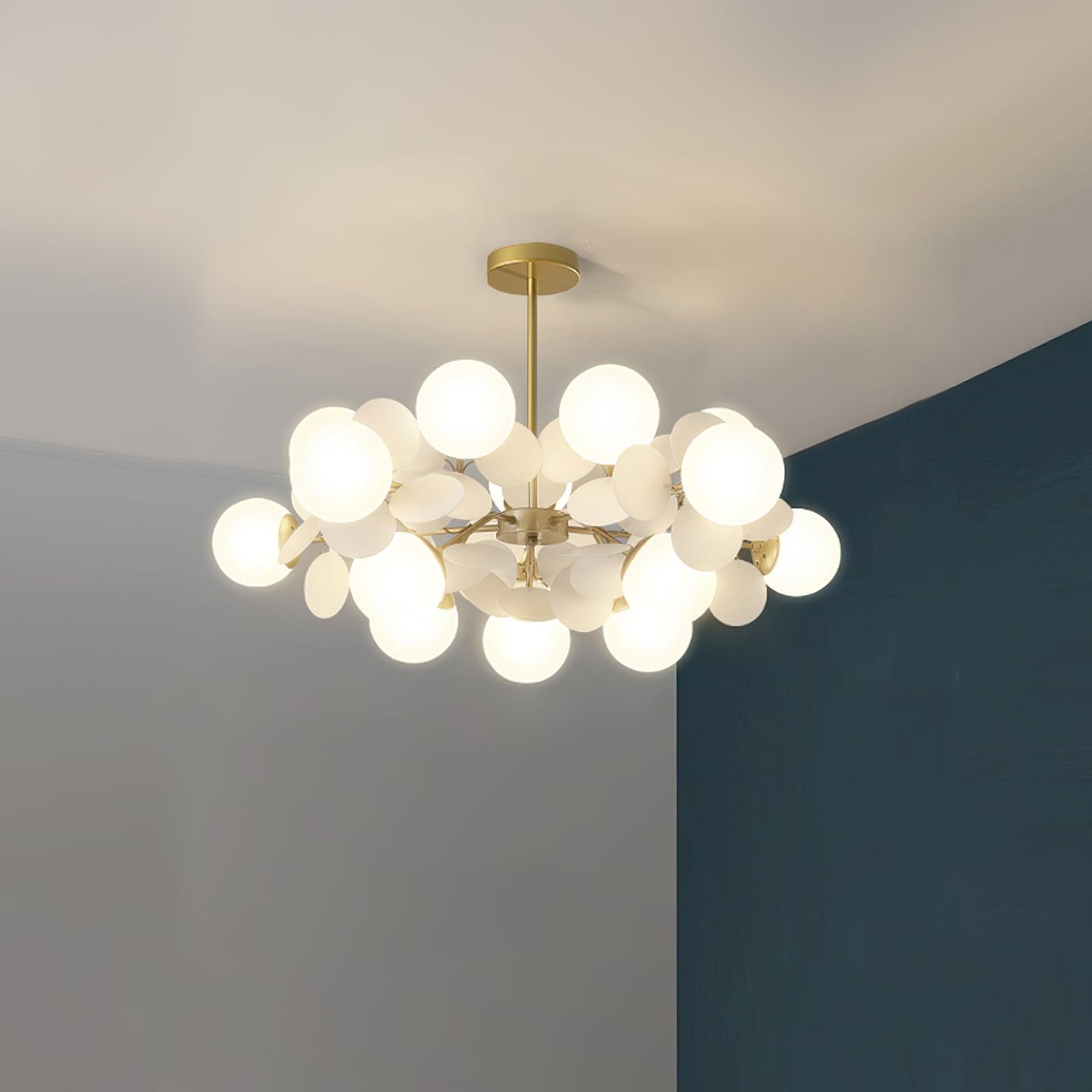 Tree chandelier hanging at full drop in a tall room