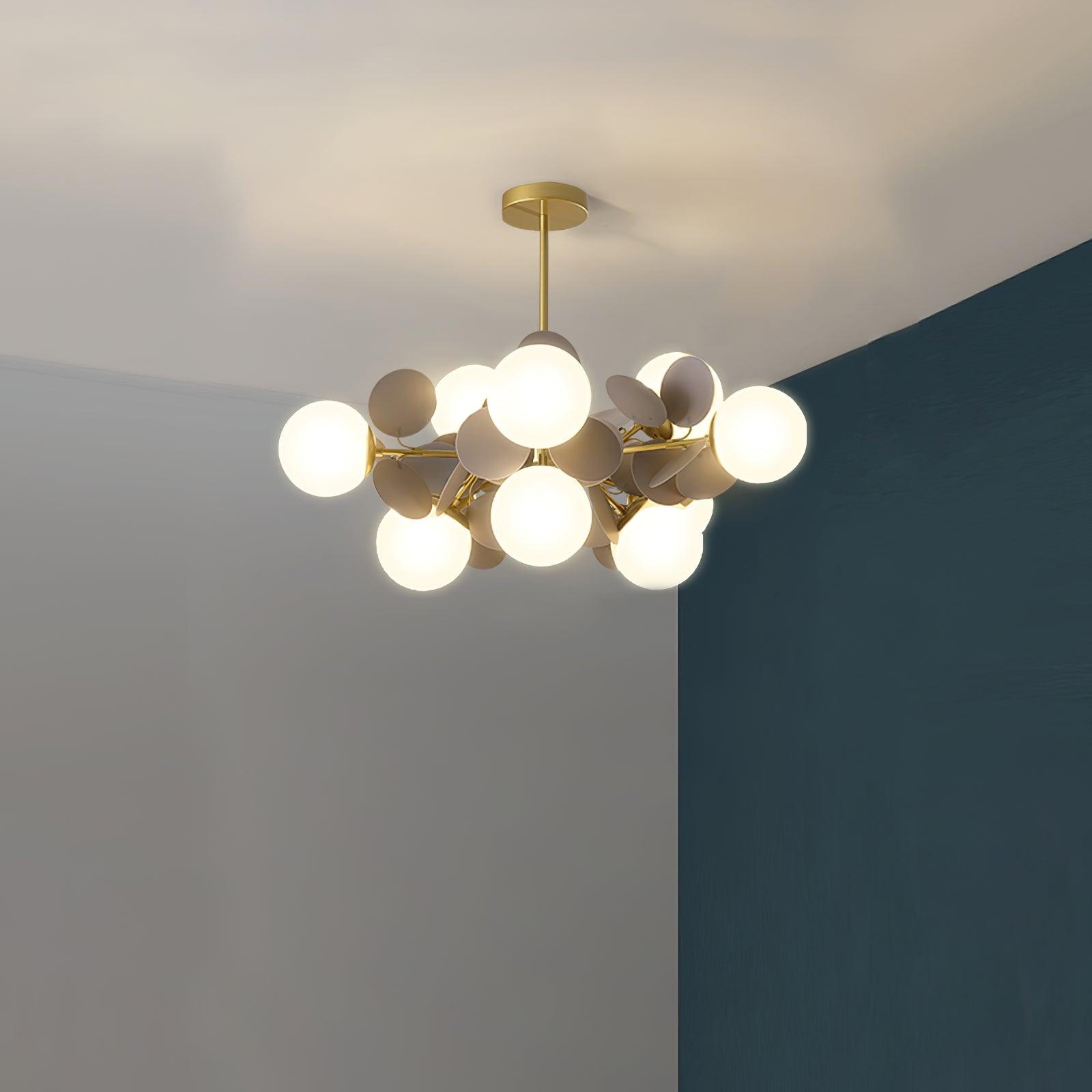 Tree chandelier detail of shade seating on the gold arm
