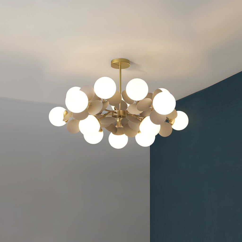 Gold tree chandelier with light angled upward for ambient fill