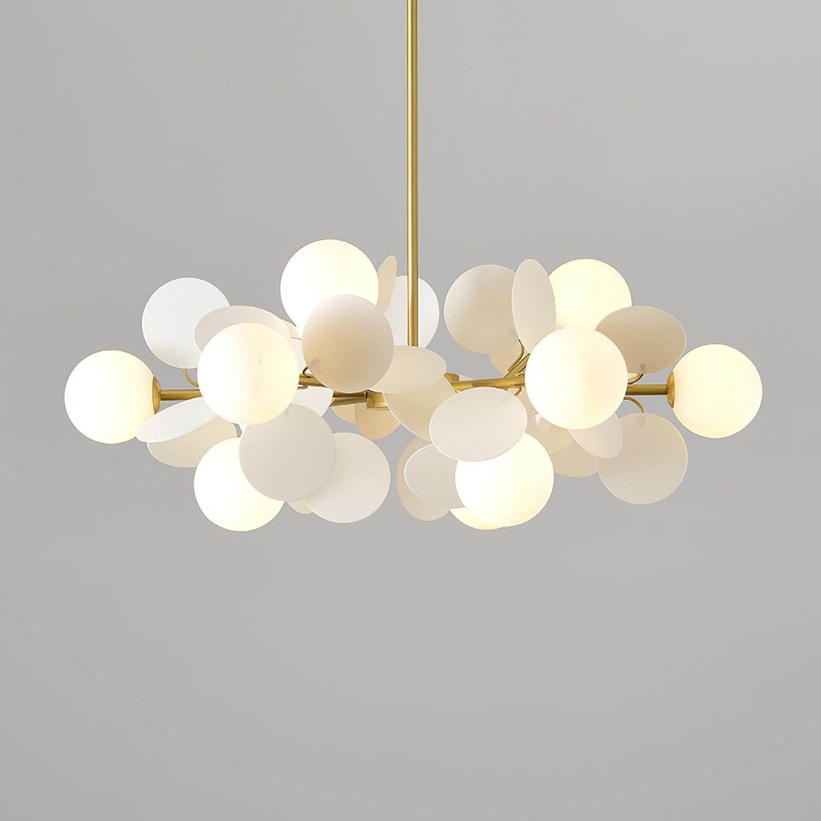 Tree chandelier above a reading nook with upward ambient light