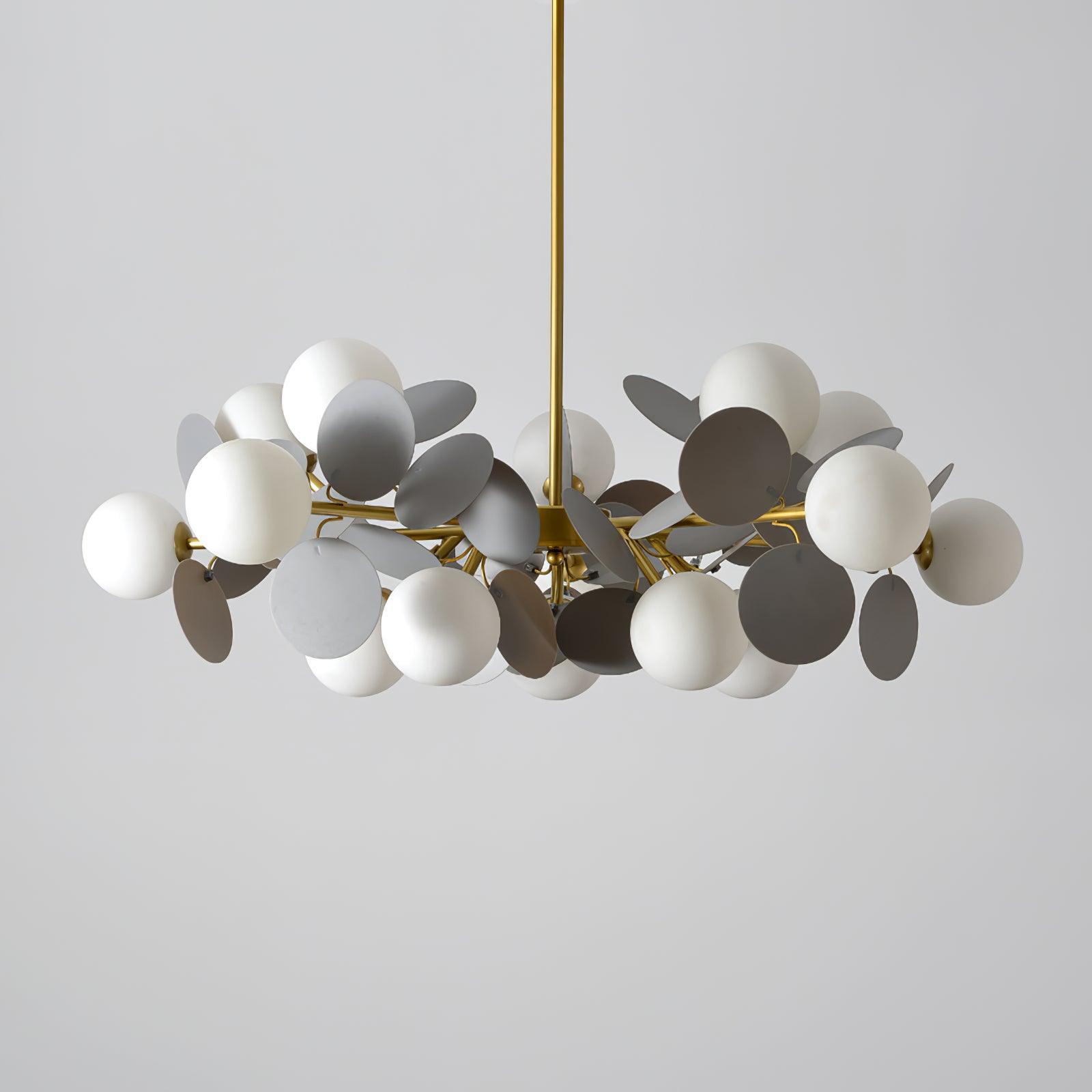 Tree chandelier close-up of the gold finish and glass shade rim