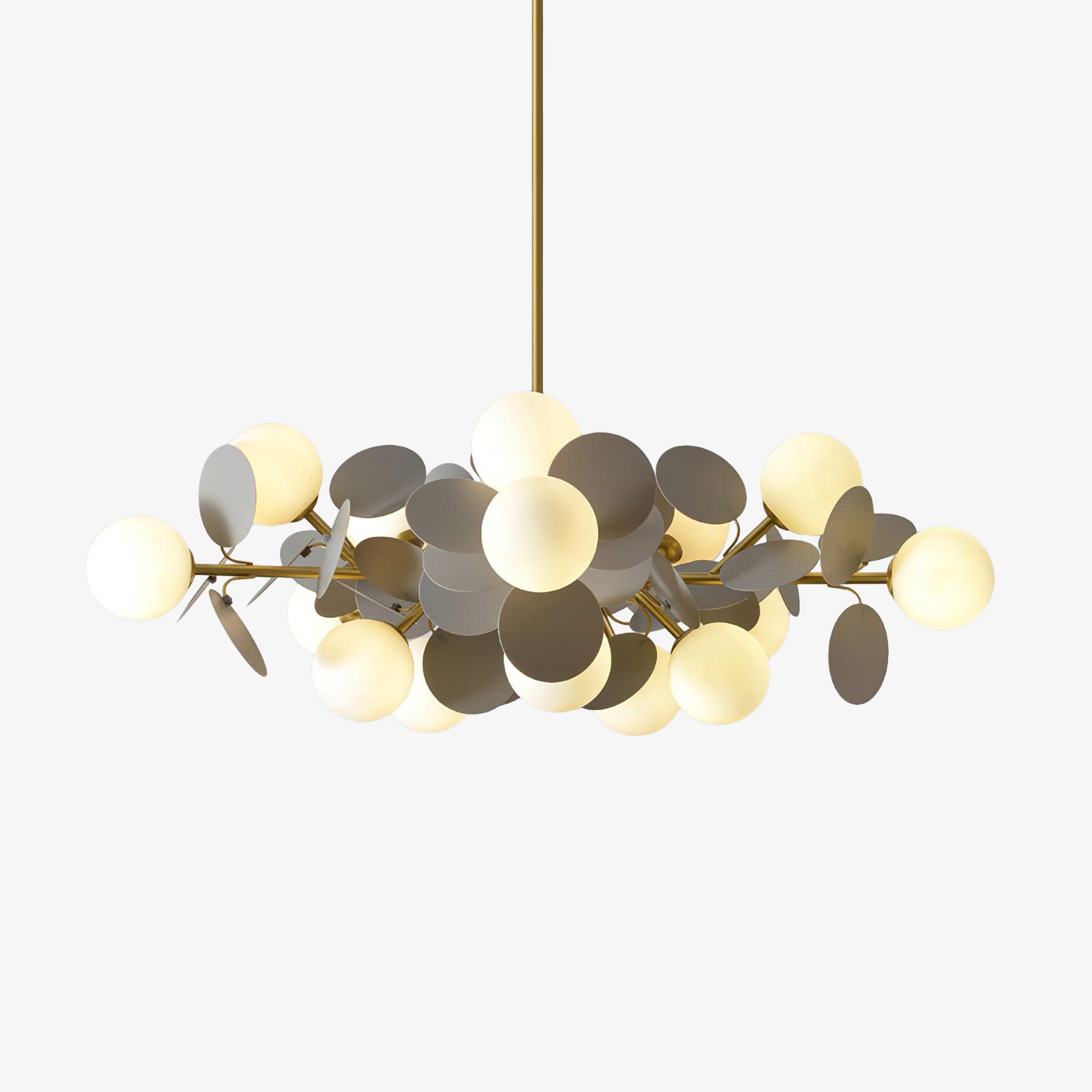 Tree chandelier hanging in a bright interior with upward ambient lighting