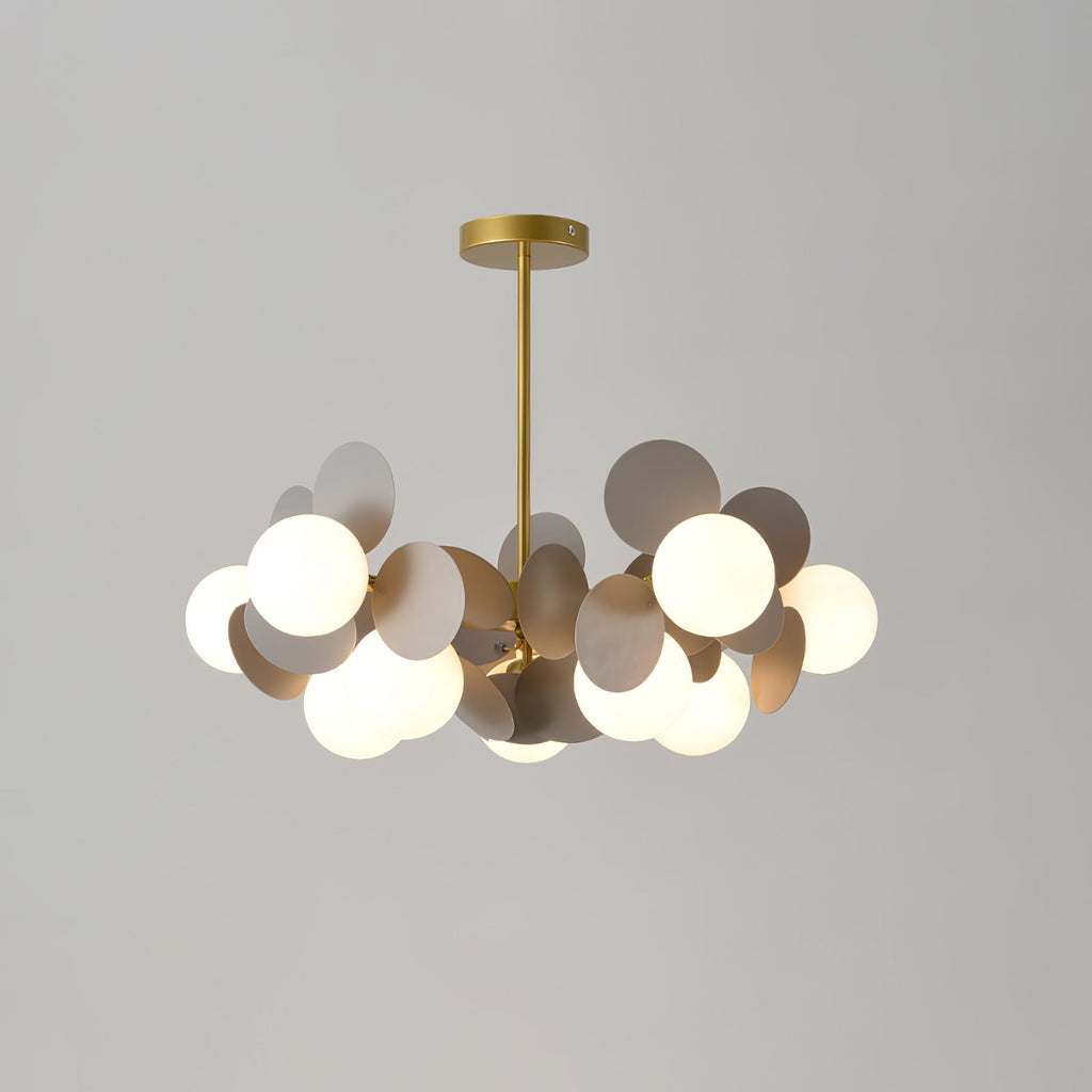 Full view of the gold branching chandelier frame holding multiple glass shades