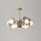 Full view of the gold branching chandelier frame holding multiple glass shades