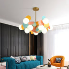 Gold tree chandelier installed above a console, casting soft ceiling light