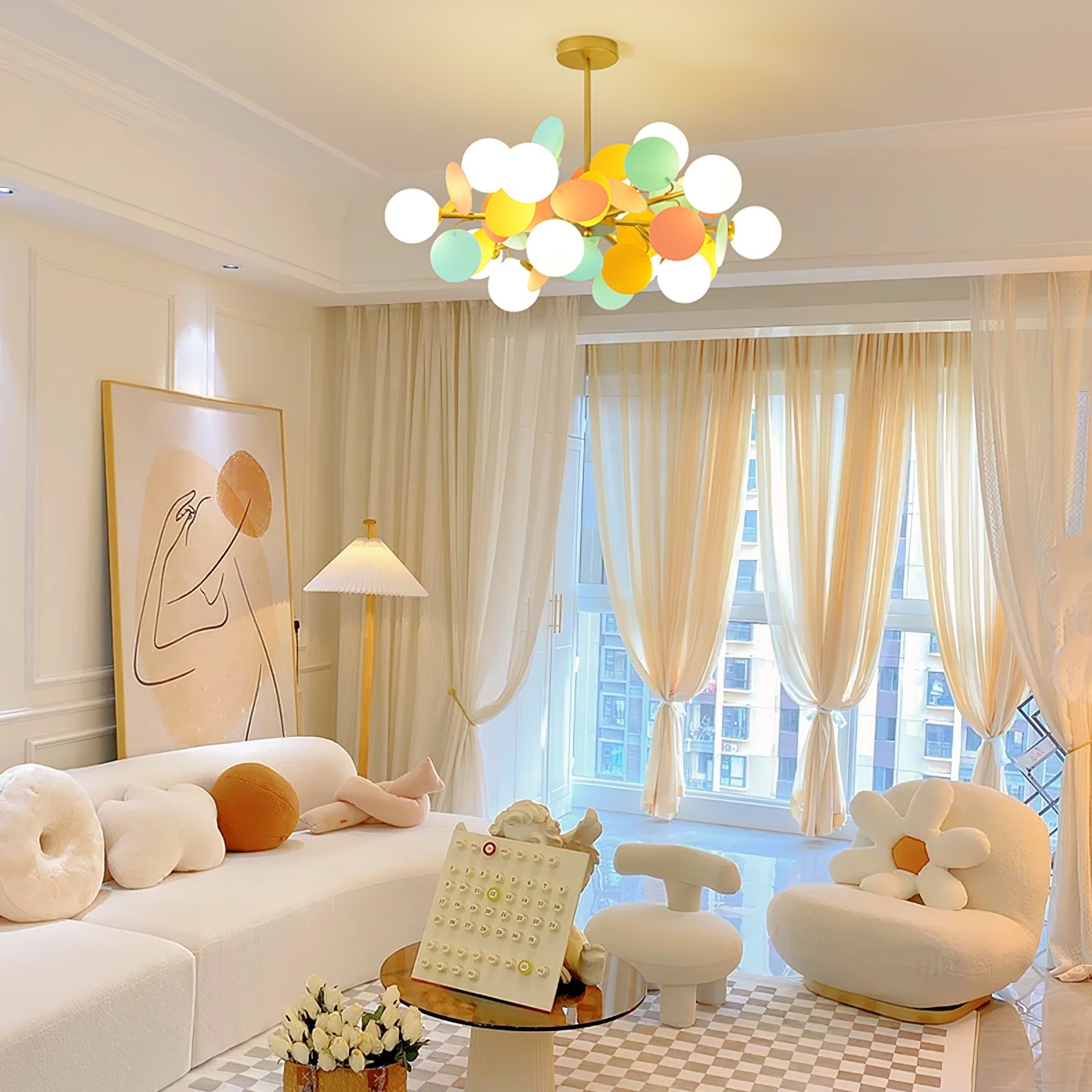 Warm-lit tree chandelier creating ambient glow in an evening interior