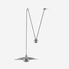 Pendant light with rounded metal shade and counterweight detail