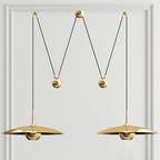 Globe pendant light shown lit with a warm glow
