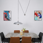 Metal pendant light viewed from the side in a room