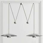 Round pendant light with polished metal finish close up