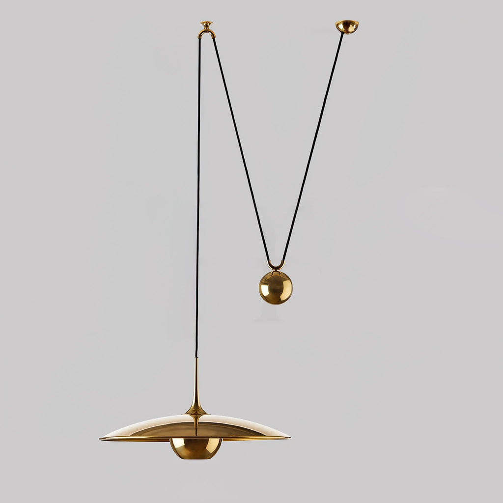 Metal pendant light detail showing the hanging cable