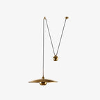 Globe pendant light styled in a cozy decorated room