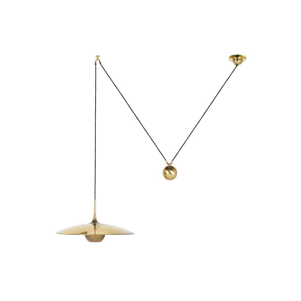 Metal pendant light hanging above a seating area