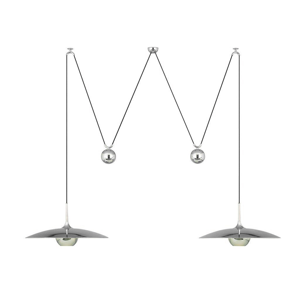 Pendant light with polished globe shade in a room setting