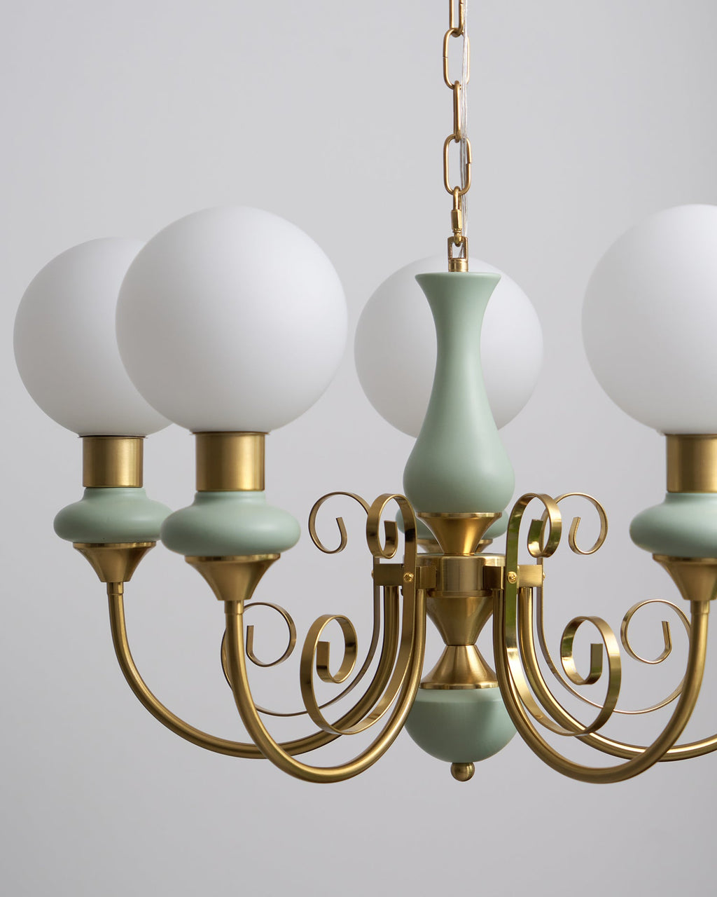 Chandelier with white glass shades in an entryway