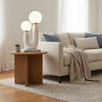 Sculptural table lamp shown beside home decor