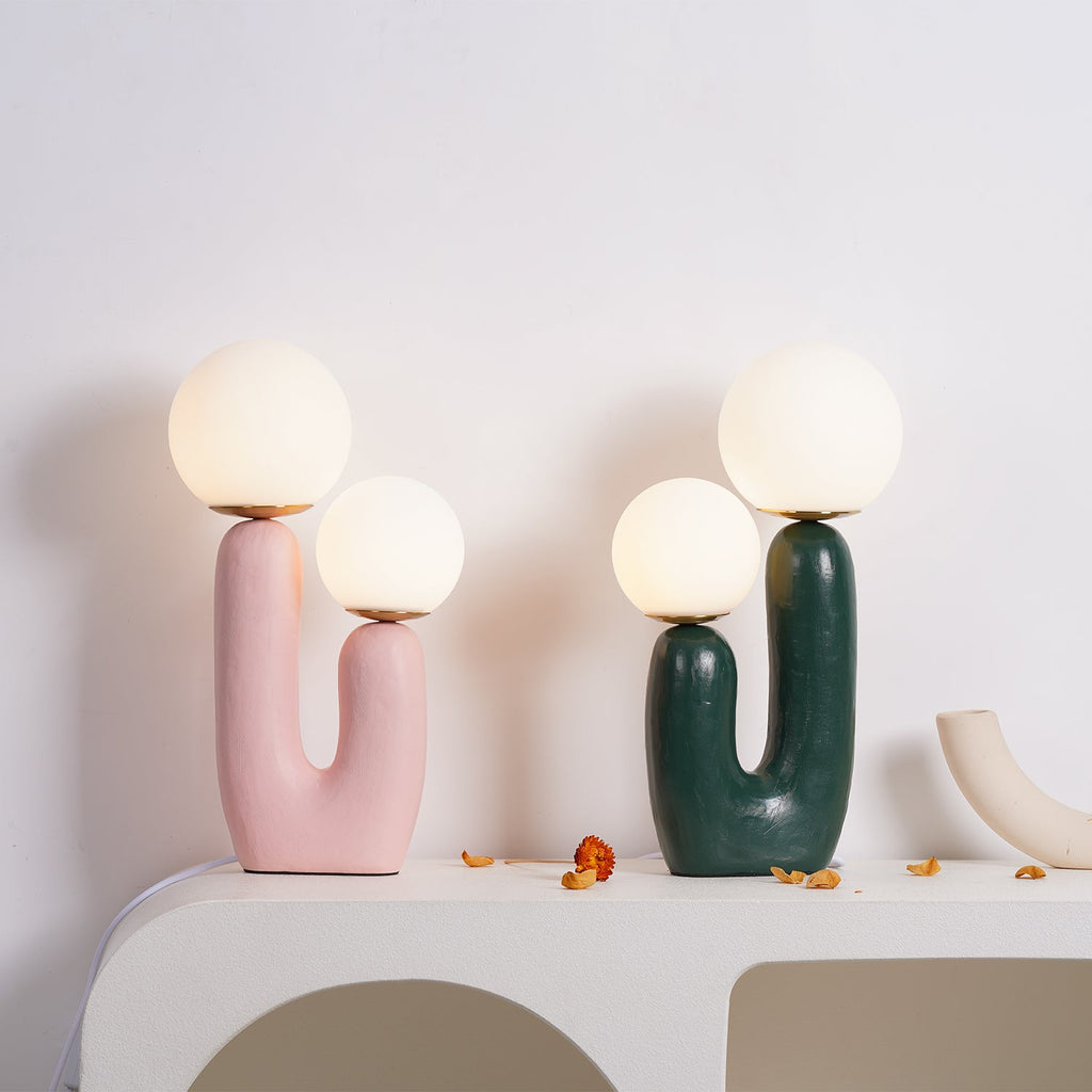 Table lamp with textured body and rounded glass globe