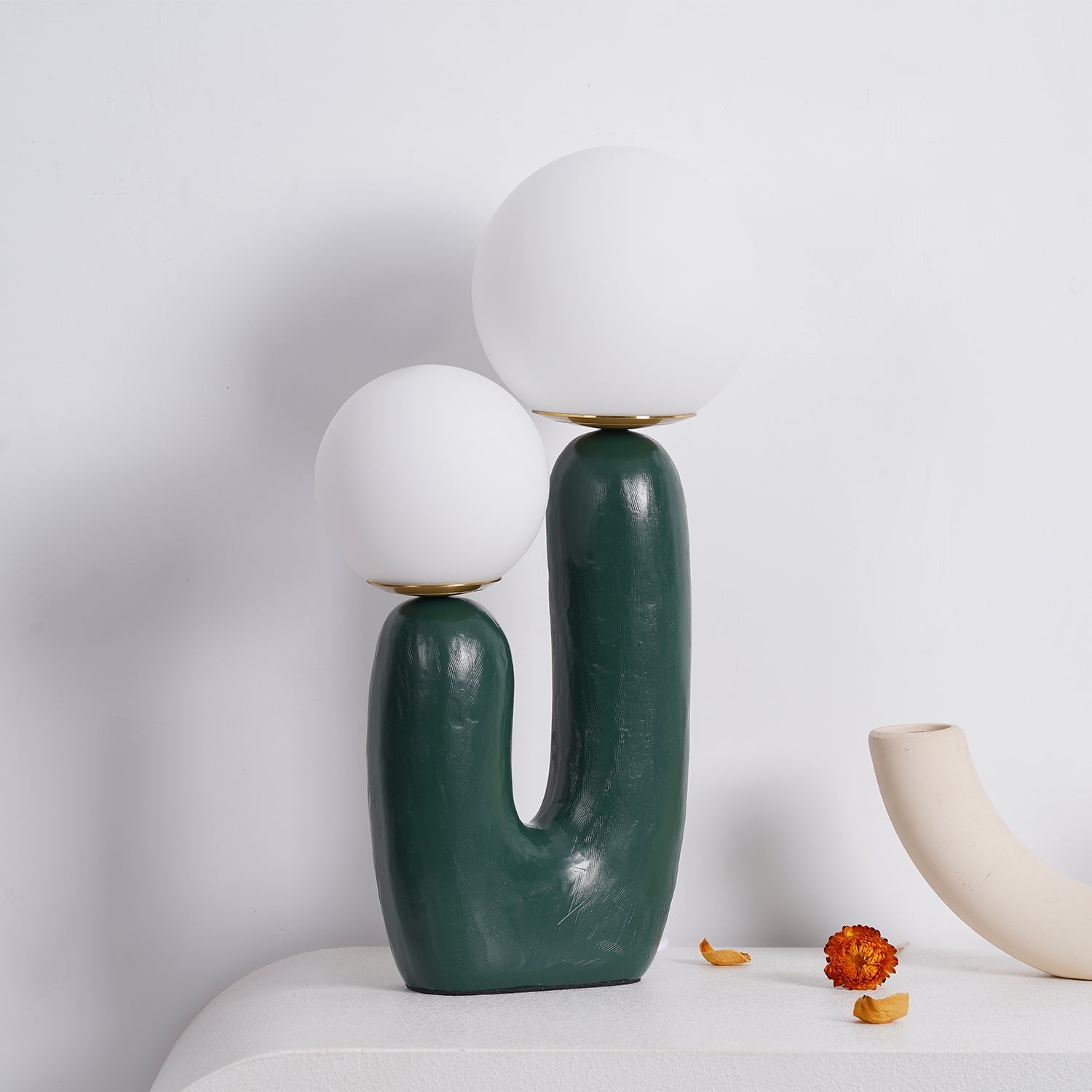Table lamp with white glass globe on a side table