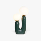 Sculptural table lamp with white glass shade detail