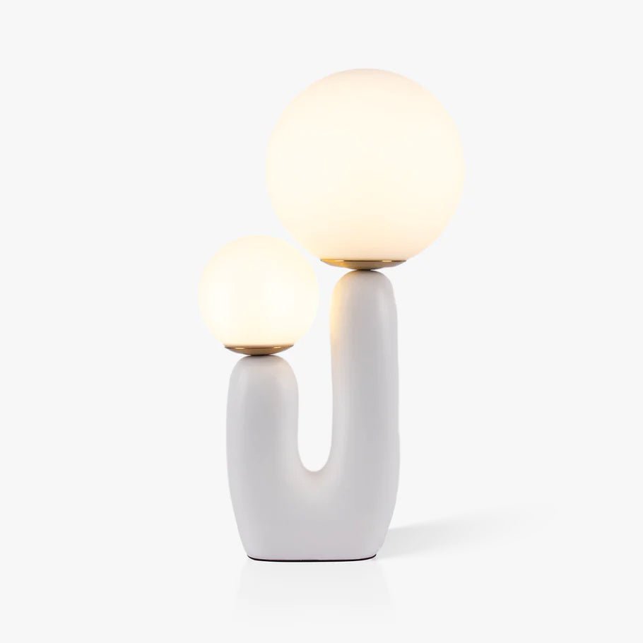 Smooth table lamp with white glass shade close up