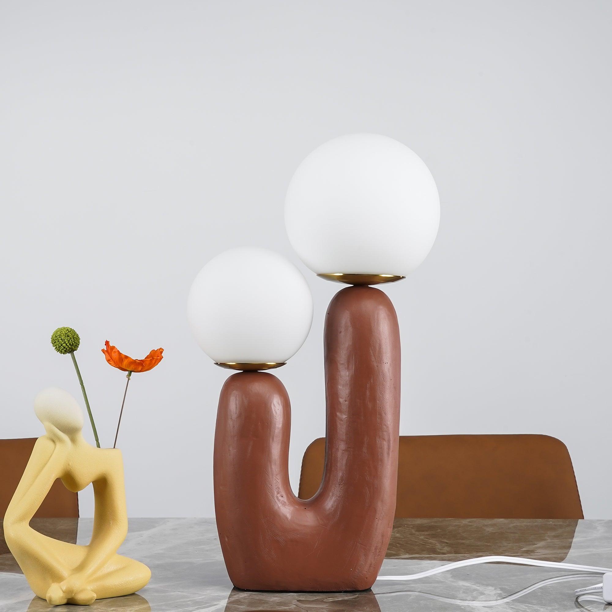 Table lamp glowing warmly in a decorated room