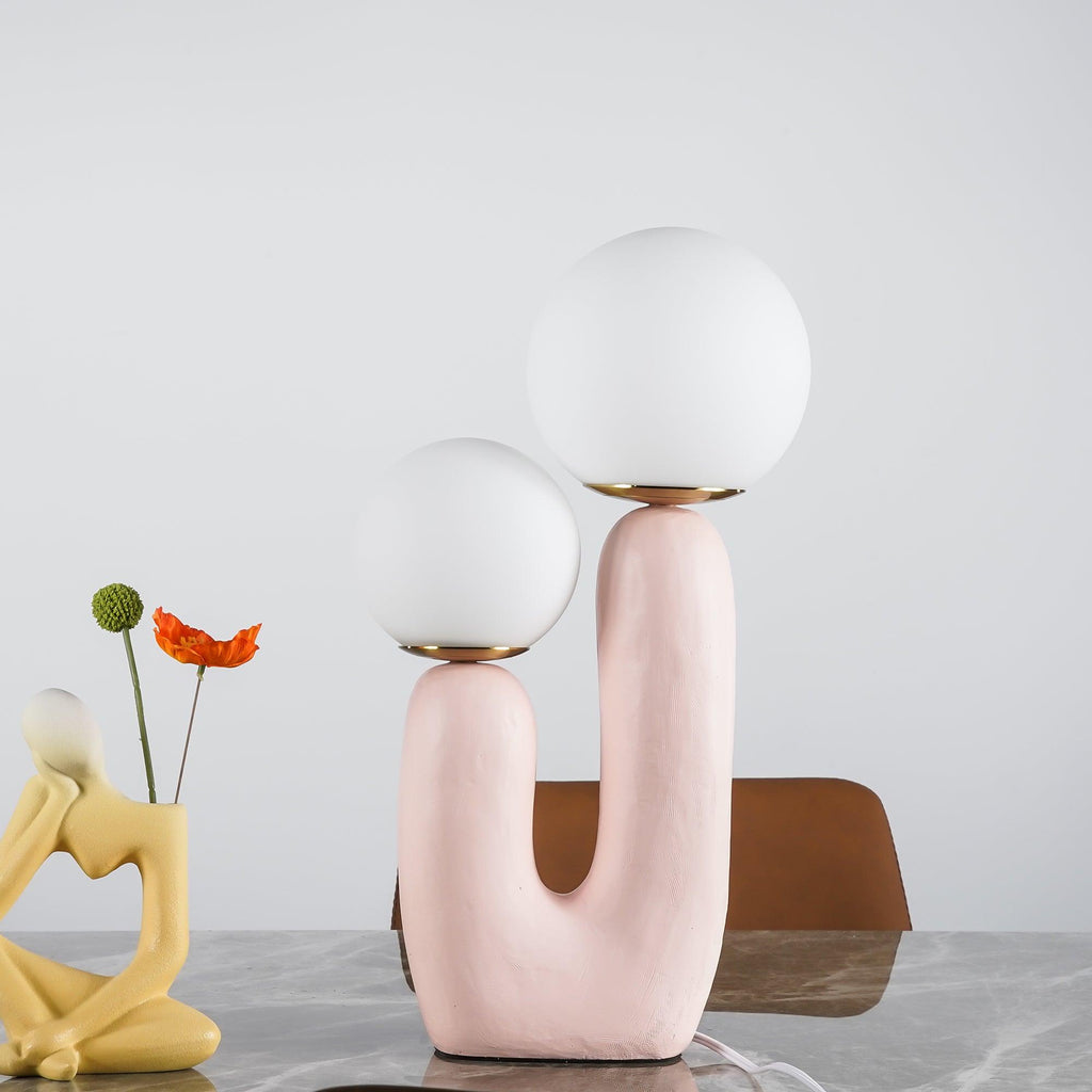 Table lamp with characterful body shown switched on