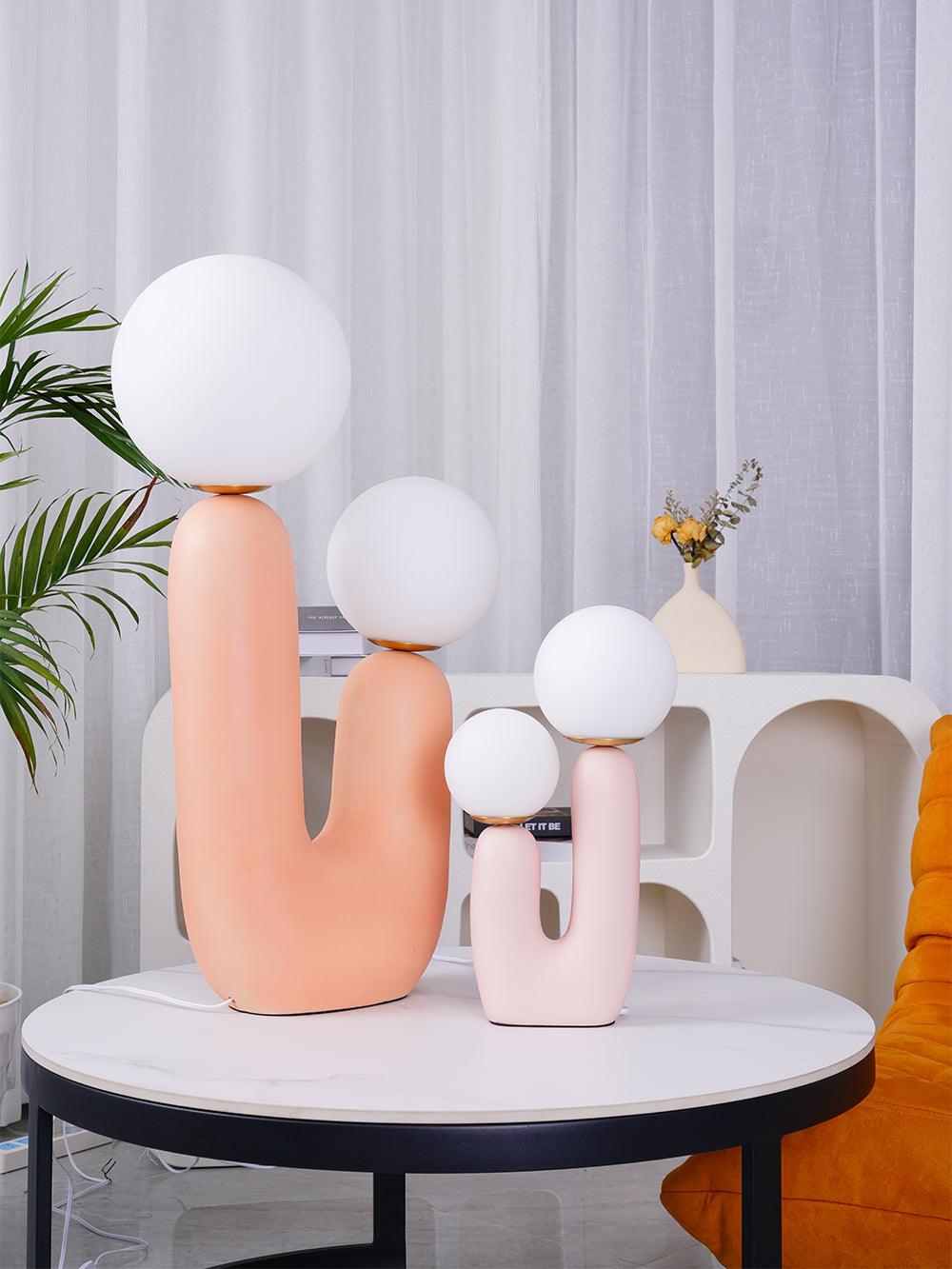 White glass globe table lamp on a styled surface