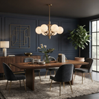 A brushed-brass Clérachic chandelier lights a navy-panelled dining room with a fiddle-leaf fig in the corner.