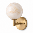 Shown in full on a plain background, this Clérachic sconce's brass arm rises to a single glowing alabaster globe.