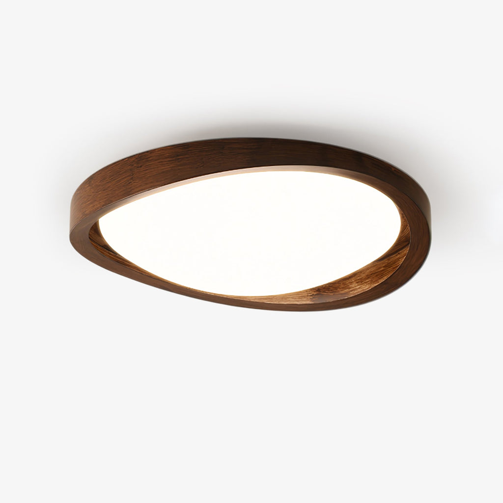 Round wooden ceiling light casting a soft even glow