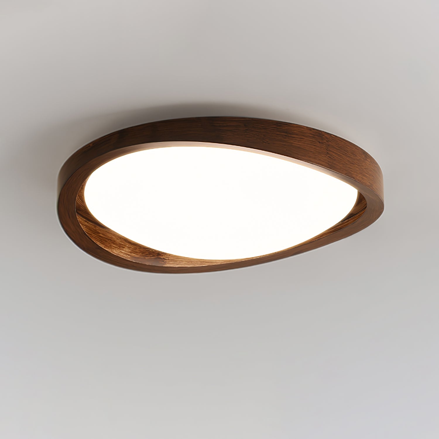 Wooden curved edge ceiling light glowing in a warm interior