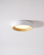 Wood-tone flush mount light shown from an angle